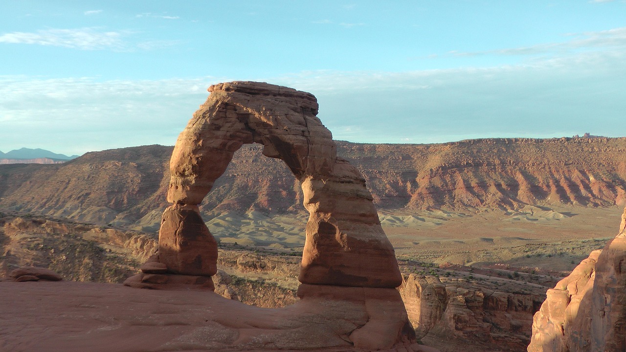 arches national park hero Delicate Arch standing tall against the desert landscape in Arches National Park near Moab, Utah.