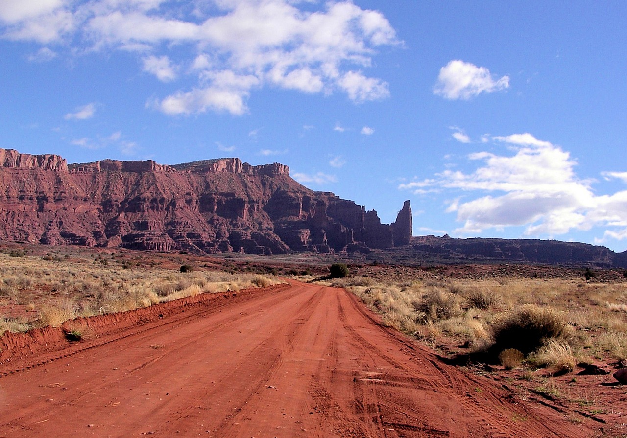 View of the Fisher Towers red rock spires with the surrounding desert and distant mesas near Moab, Utah